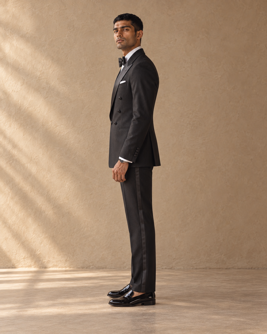 The Nocturne black double-breasted fine-wool tuxedo, full-length side profile