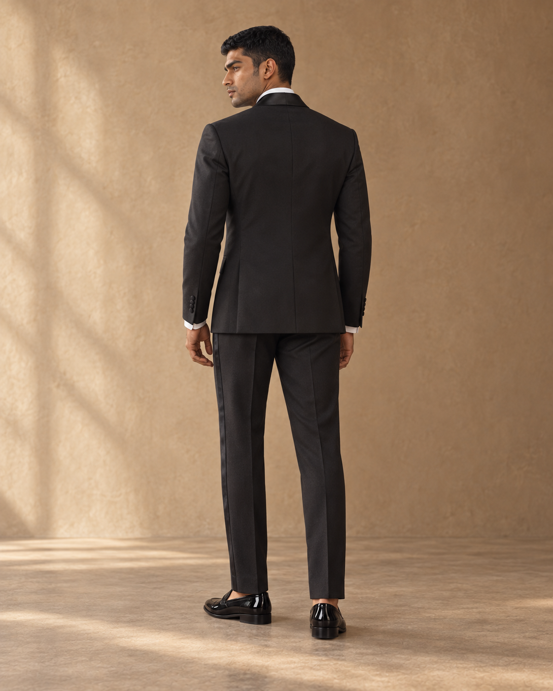 The Vesper black shawl-collar fine-wool tuxedo, rear fit view