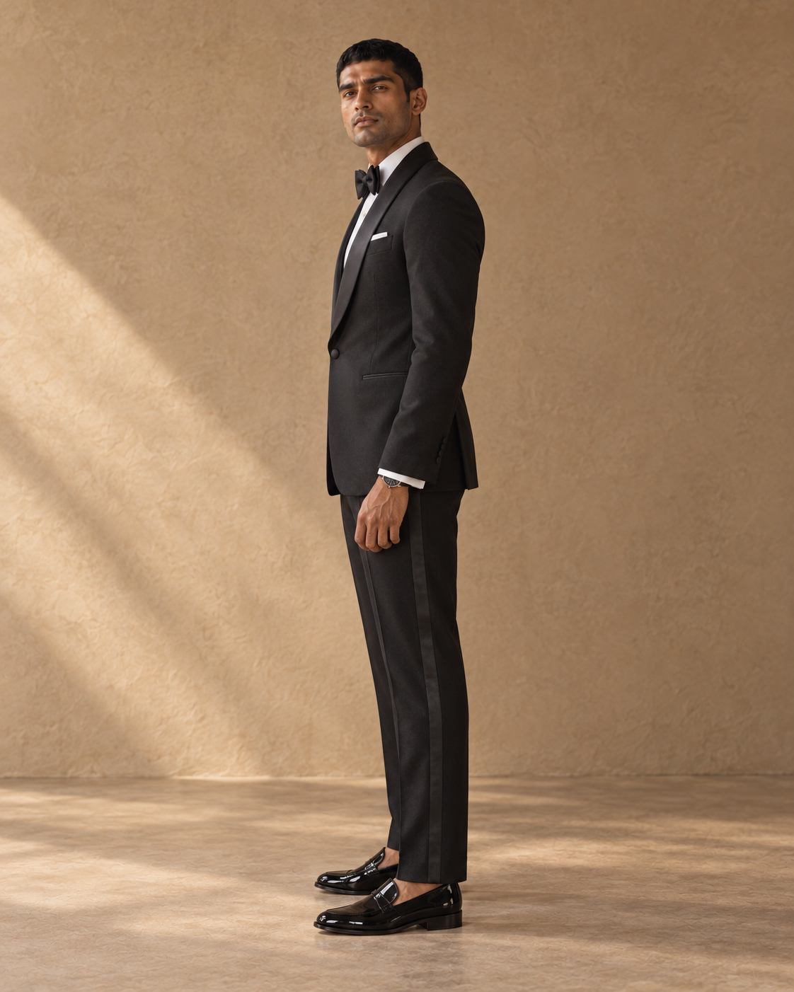 The Vesper black shawl-collar fine-wool tuxedo, full-length side profile