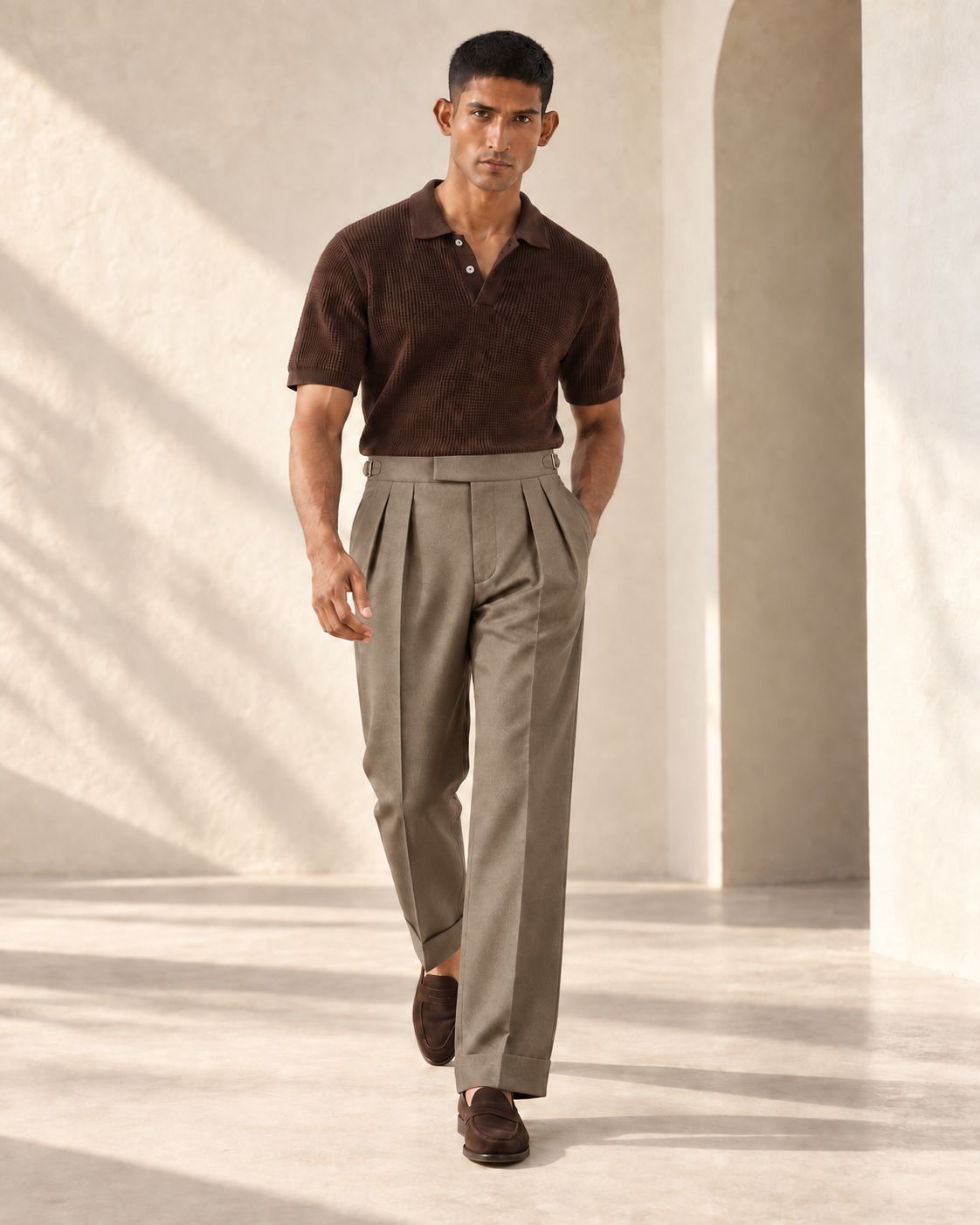 SALVE The Cadogan double-pleated trousers in khaki, shown walking