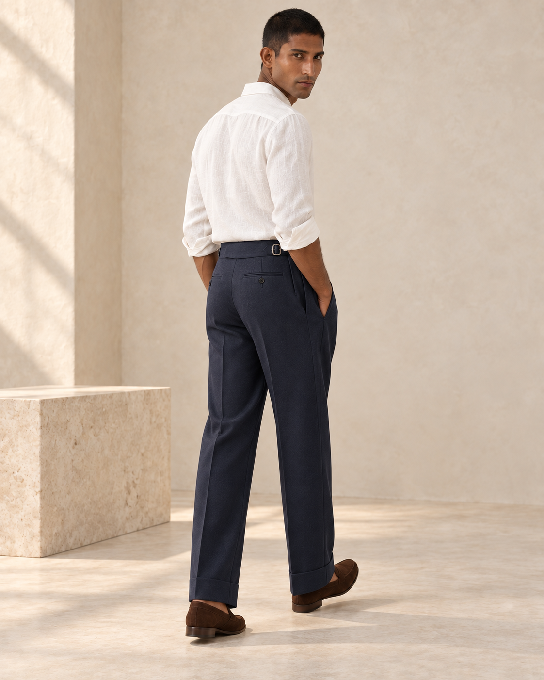 SALVE The Cadogan double-pleated trousers in navy, rear three-quarter view