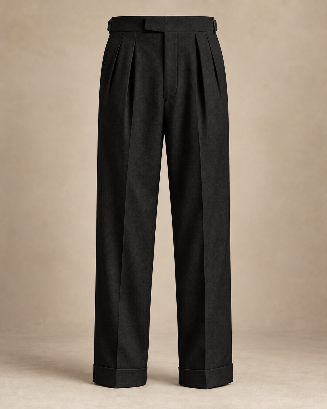 SALVE The Cadogan double-pleated trousers in black, extended waistband, pleats and turn-up detail