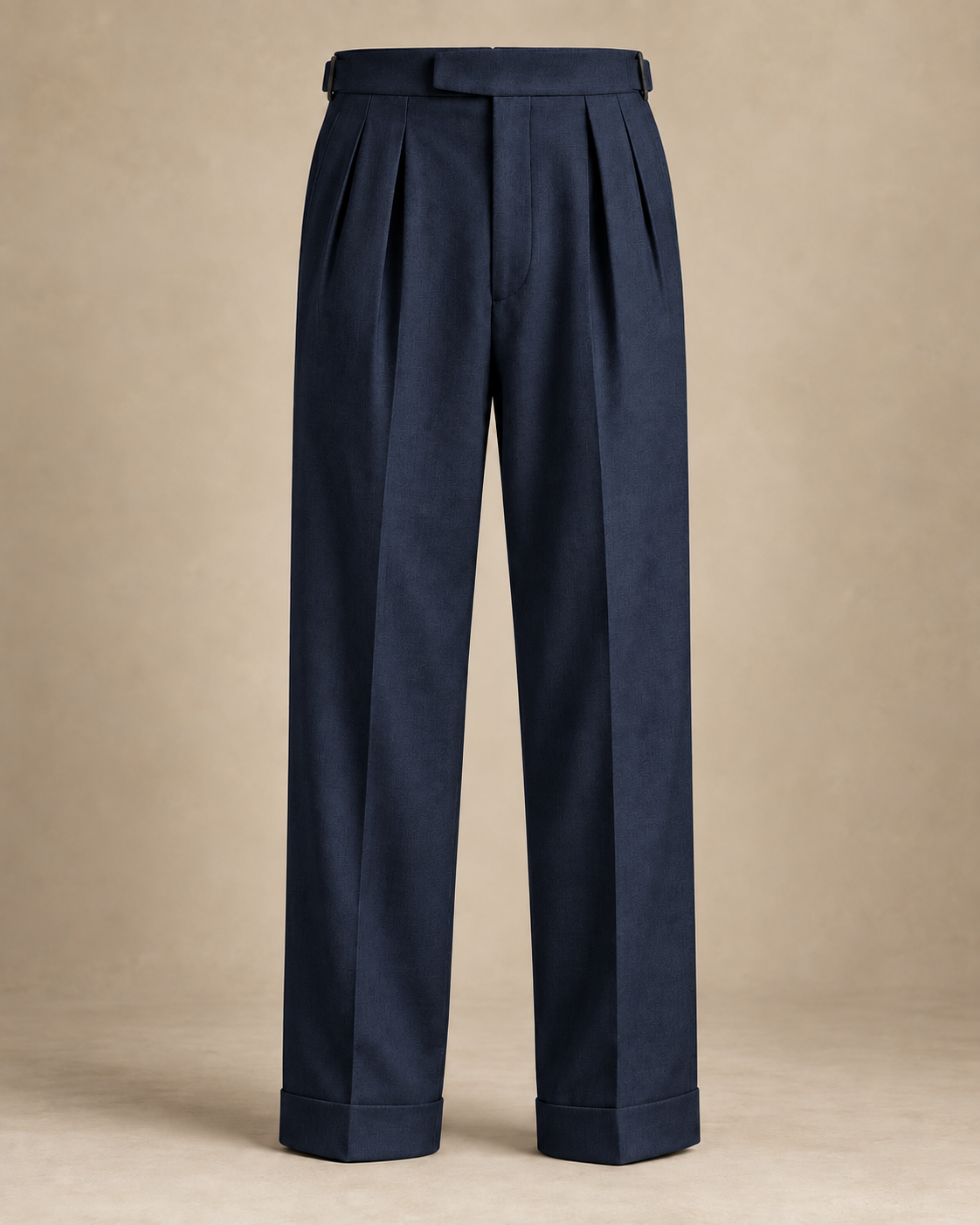 SALVE The Cadogan double-pleated trousers in navy, extended waistband, pleats and turn-up detail
