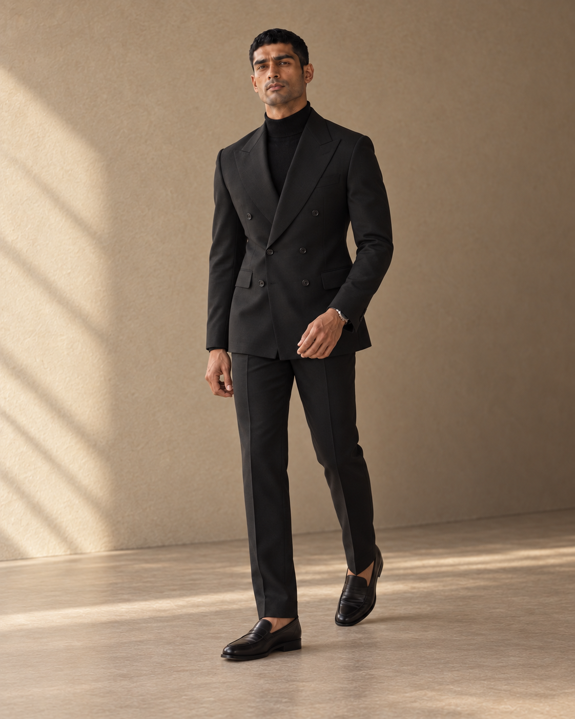 The Regent black double-breasted fine-wool suit shown in movement
