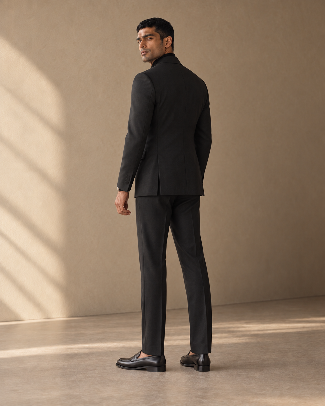 The Regent black double-breasted fine-wool suit, rear fit view