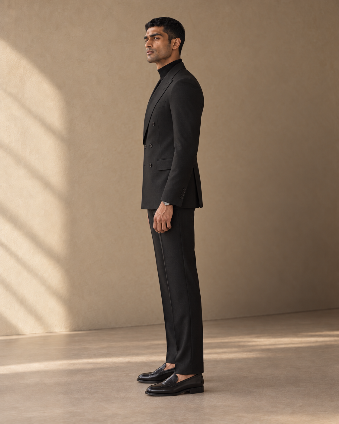 The Regent black double-breasted fine-wool suit, full-length side profile