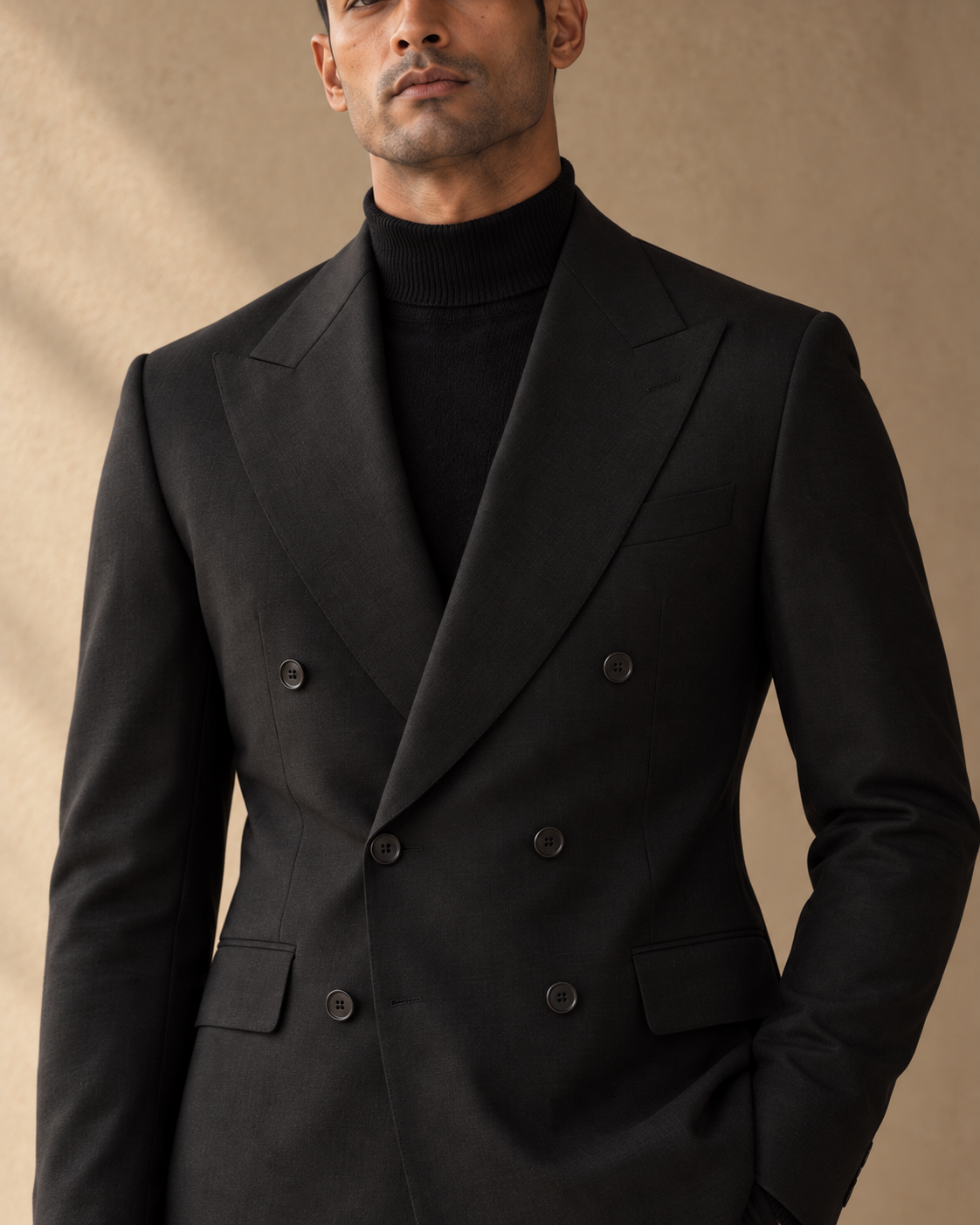 The Regent black fine-wool suit, peak lapel and button detail