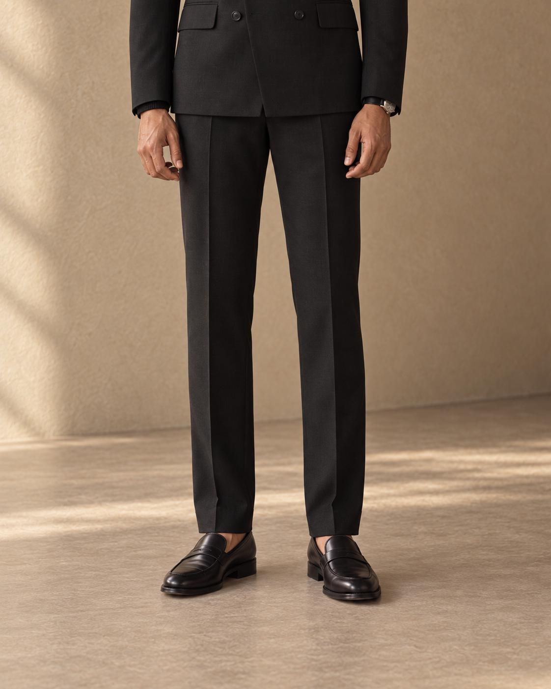 The Regent black fine-wool suit, straight trouser line and loafers