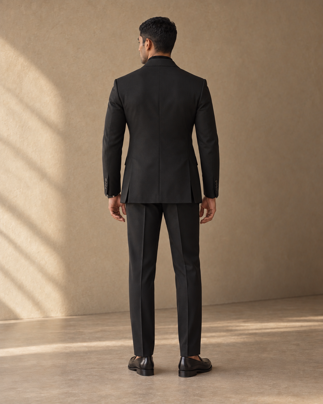 The Regent black fine-wool suit, rear jacket construction detail