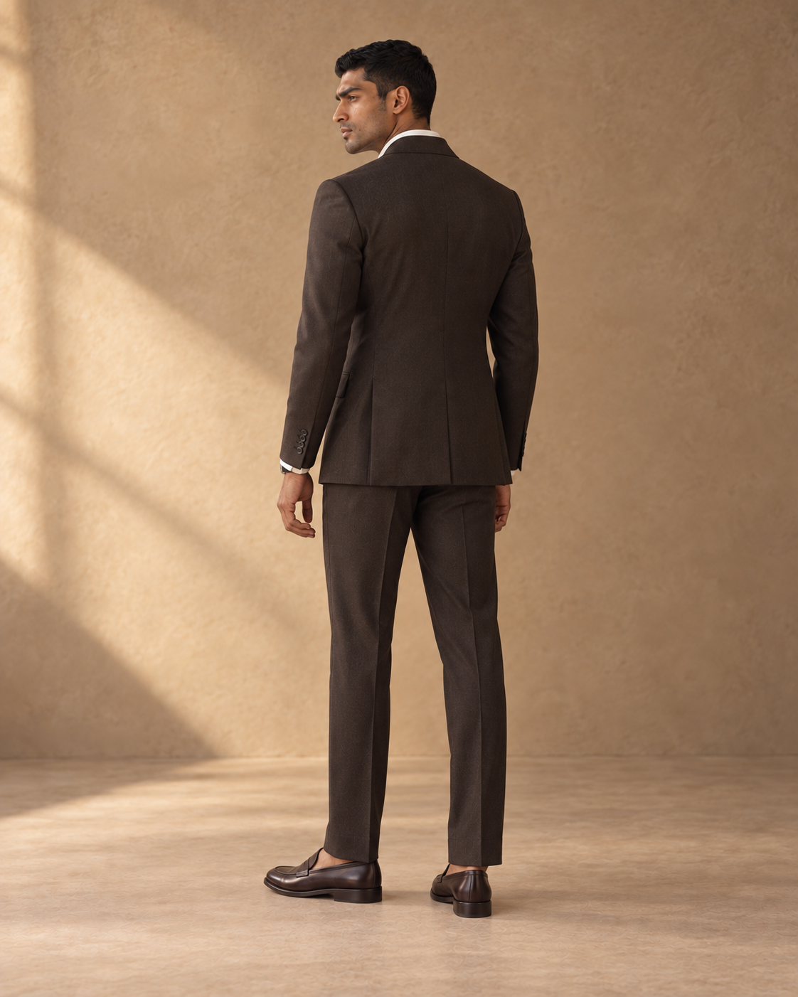 The Regent dark-chocolate double-breasted fine-wool suit, rear fit view