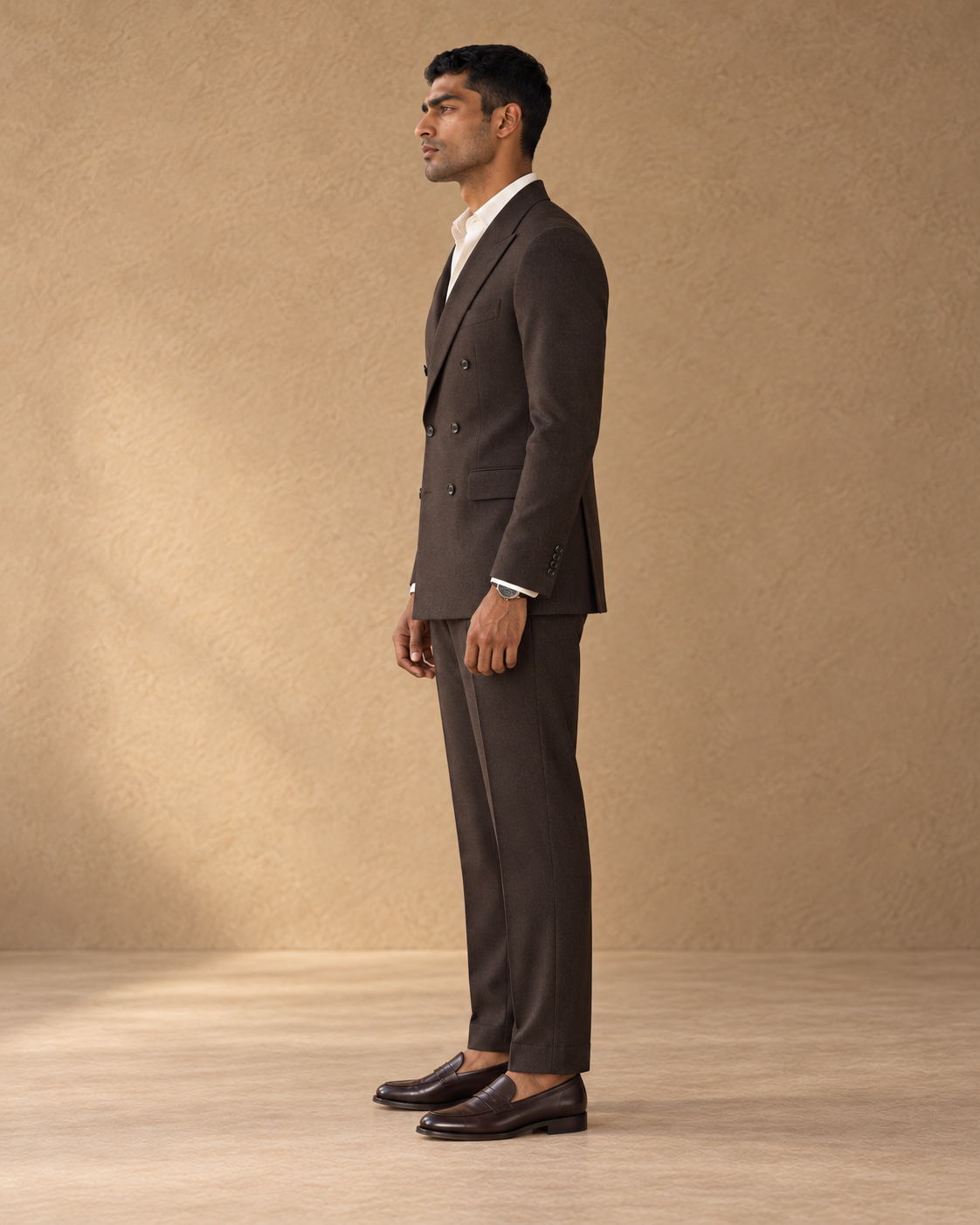 The Regent dark-chocolate double-breasted fine-wool suit, full-length side profile