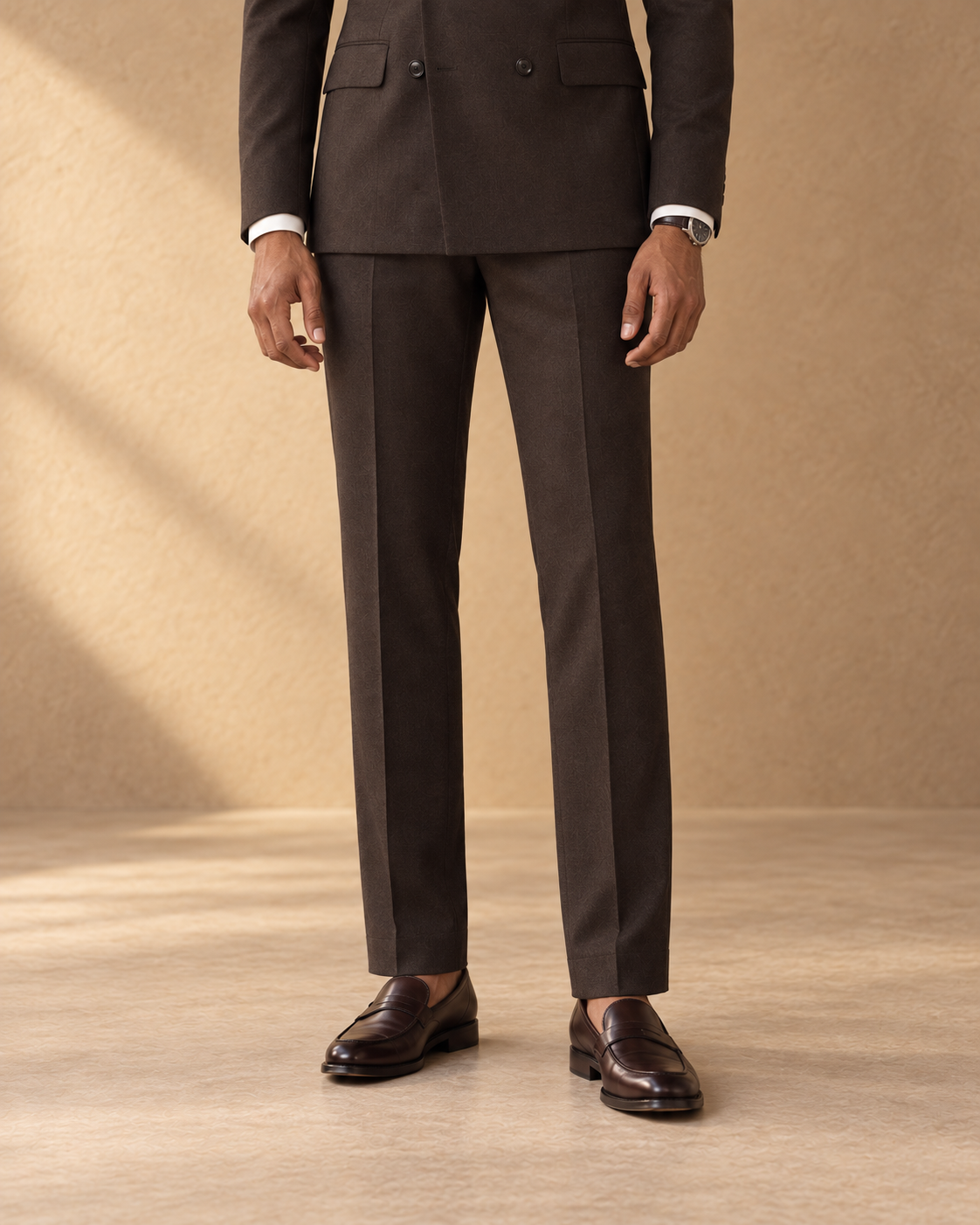 The Regent dark-chocolate fine-wool suit, straight trouser line and loafers