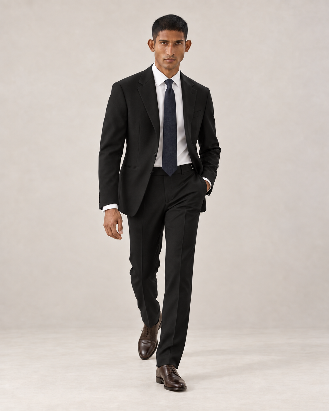 SALVE The Lutyens two-piece suit in black, shown walking