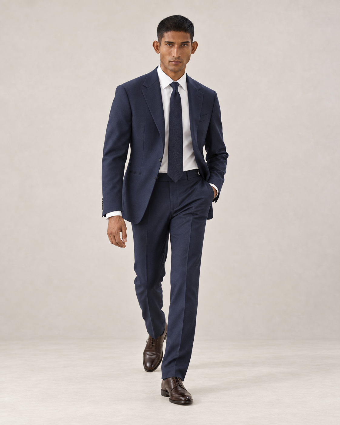 SALVE The Lutyens two-piece suit in navy, shown walking